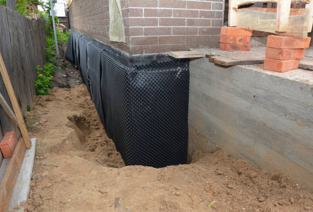 Happy homeowners after waterproofing job in Roundhead